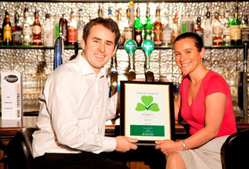 General Manager of The Baggot Inn Eddie Fitzgerald receiving a certificate of recognition as part of Fáilte Ireland’s national standards scheme for pubs - Raising the Bar - from Jennifer Churchward, Quality and Standards Division, Fáilte Ireland.